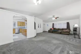 View of living room, kitchen and entry from dining area