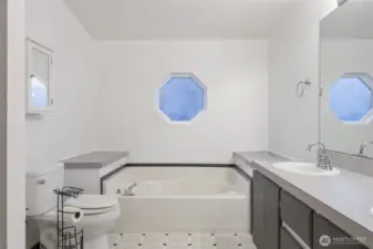 Primary bathroom with double sinks and separate shower.