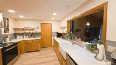 Custom kitchen with designer tile back splash and quartz counter tops