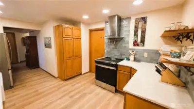 Gourmet kitchen with walk-in pantry and ample storage