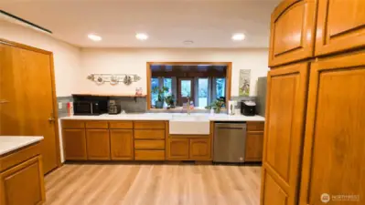 Large family room with wood stove and ceiling fan