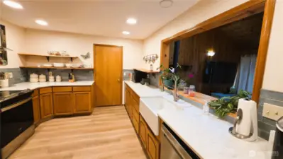 Beautiful kitchen with pass-thru for easy entertaining.