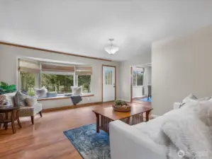 Spacious living room with large bay window
