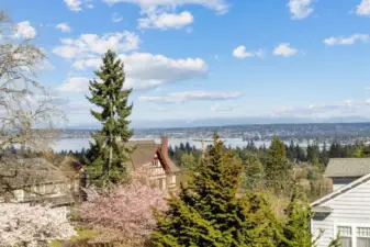 Sparkling Lake Washington and snowy Cascade Mountain views from three levels.
