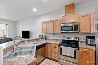 Kitchen offers lots of storage space and stainless steel appliances
