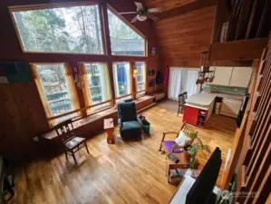 Looking down from the loft at the living room and part of the kitchen.