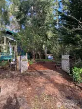 Double gates open to the expansive backyard and entry to the home.