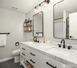 Stylishly remodeled bathroom with plenty of storage.