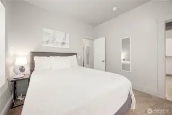 Second Bedroom leading out to the hallway, mudroom and kitchen.