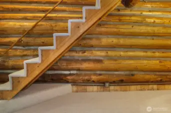 Stair leading to upper bedroom.