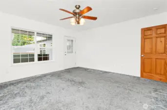 Primary bedroom with outside entrance to large back deck and 6 person hot tub.