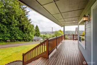 Front porch with a beautiful view of the South Fork of the Willapa River and rolling hills.