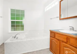 Primary bathroom includes a jetted tub.