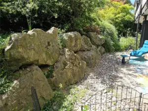 The large rock wall creates a cove of privacy.