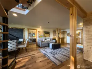 Spacious and inviting lower level also has Views.  Step out to Manicured Lawn, Firepit and Views.