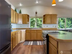The spacious kitchen offers ample counter space and storage.