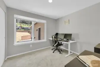 Light and bright bedroom or office with new carpet.