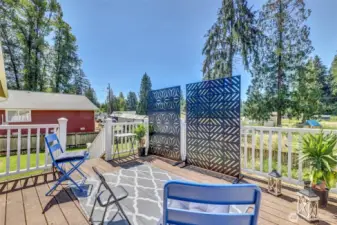 Deck off dining room with stairs to back yard. Low maintenance materials. possibly Trex.