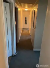 Long hallway in North wing of house connects 5 bedrooms and Main bathroom to the rest of the house. Linen closets provide ample storage. Light have motion sensers and atic in this part of house can be reached with pull down stairway with lots of storage above.