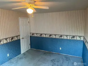 4th Bedroom with blue carpet and room for large bed.