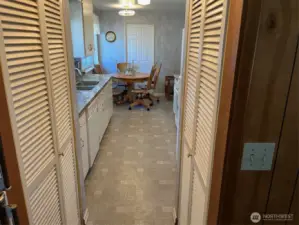Pantry on either side Kitchen eating nook with pocket door between kitchen and entry.