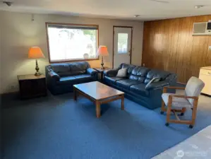 Far corner is side entry to house with steps down to driveway from living room.