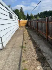 RV/Extra Vehicle parking on East Side of Shop. Shop is 40 ft long and this parking area extends all the way to street which is