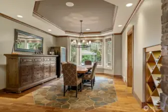 The formal dining room with a slate-inlaid floor and built-in wine storage.
