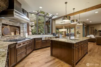Professional grade Wolf appliances, including a 6-burner stove with griddle, double ovens, a built-in 48-inch refrigerator and walk-in pantry.