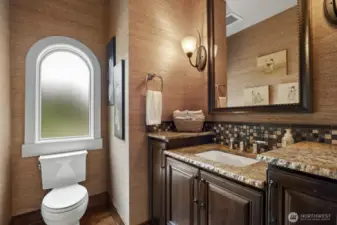The guest powder bath furniture style vanity and live edge granite.
