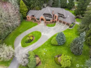 Expansive circular driveway and commanding street presence.