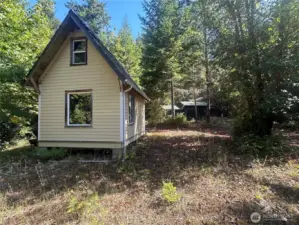 Off-grid tiny home with shop.