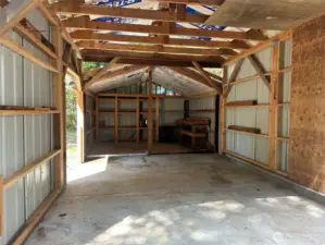 Interior of garage with cement floor.