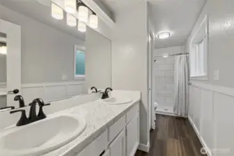 Beautifully updated en suite with dual sinks, new granite, and tiling gives this space a bright start to your morning routine.