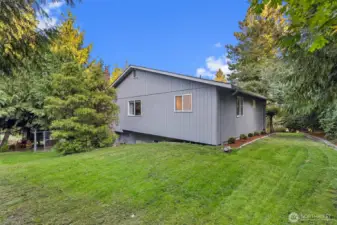 Enjoy a peaceful, private backyard surrounded by evergreens. This private space is perfect for play, gardening, or quiet relaxation.