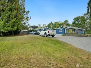 Expansive lot with mature trees and ample parking