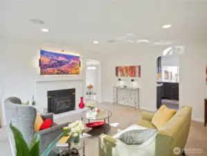 This cozy space features a modern glass-top dining table, sleek chairs, and vibrant wall art.