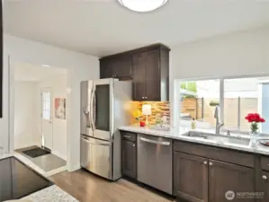 pacious kitchen with ample counter space and a large window—perfect for cooking with a view.