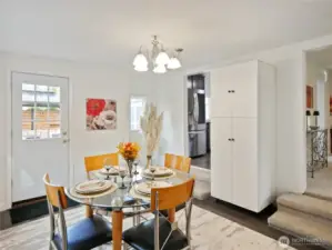 Open dining area with access to kitchen and outdoor space
