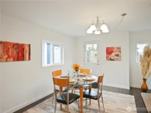 A cozy nook with floral accents and soft lighting—perfect for meals or morning coffee.