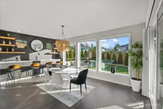 Wet bar and dining room gleaming in natural light