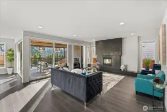 Grand room with fireplace, facing the outdoor patio