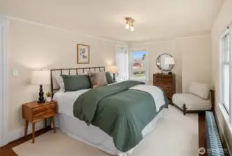 Spacious primary bedroom with king bed.