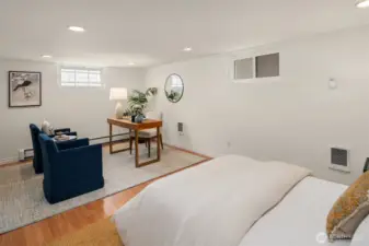 The lower-level rec room with Murphy bed provides exceptional flexibility as a guest suite, media room, or home office.