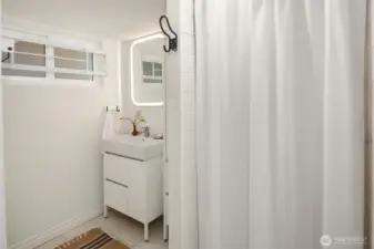 Lower-level bathroom features a walk-in shower.
