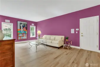 Family/media room with bookcase and wet bar.