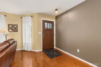 Enter the home onto beautiful hardwood floors.