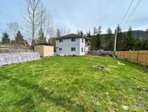 Large fully fenced yard with above ground swimming pool