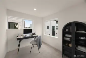 This image is virtually staged. This bedroom with bright windows and clean lines—ready for your creative layout.