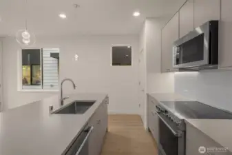 Clean lines and thoughtful design make this kitchen a standout, with tons of counter space, storage, and natural light.